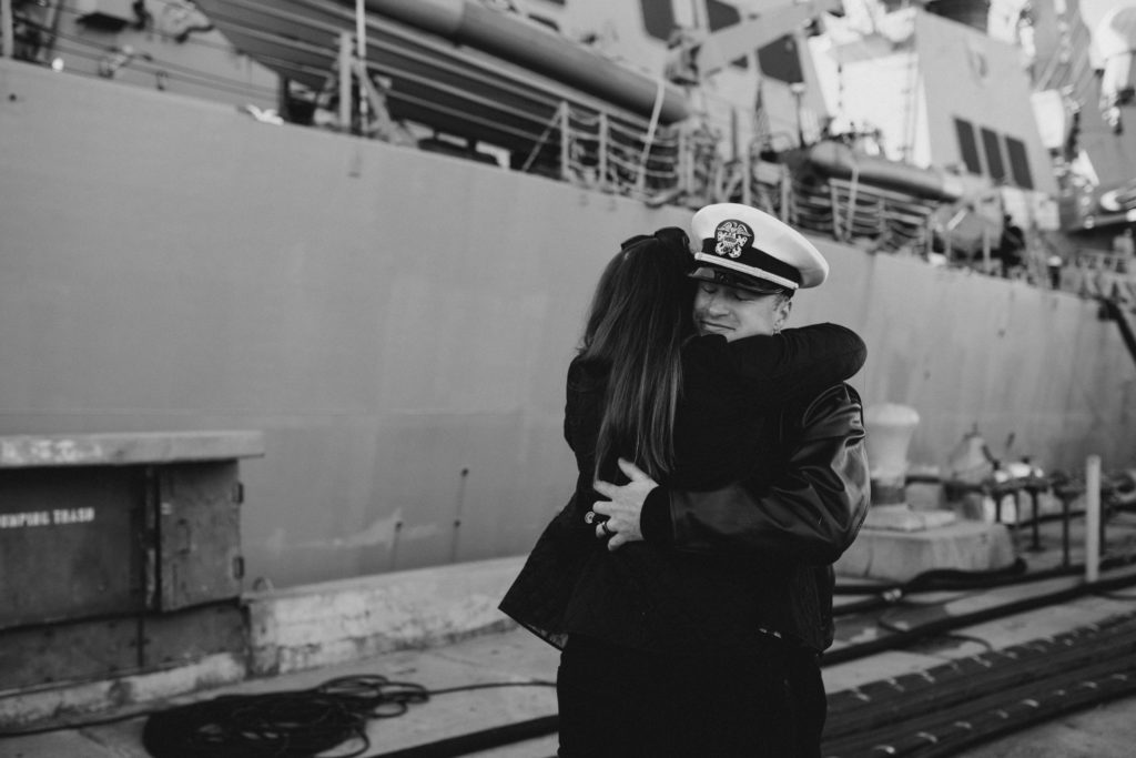 officer hugs his wife goodbye before heading out on deployment for 10 months